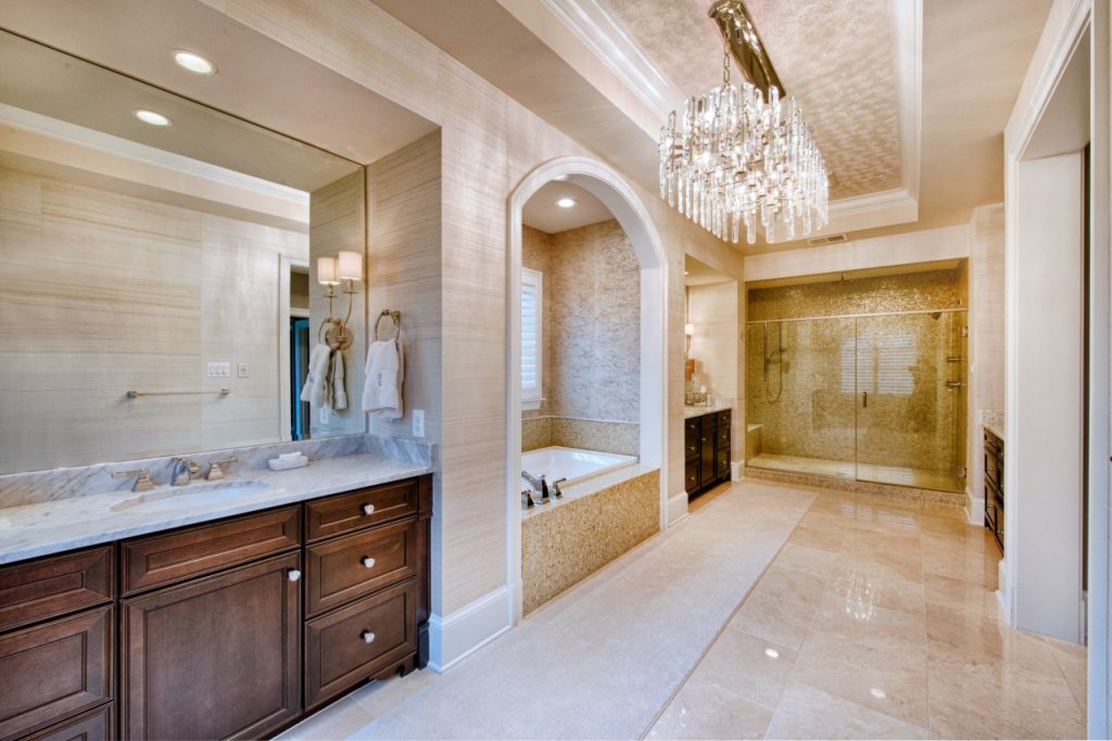 bathroom remodel with large vanity, walk in glass door shower and bathtub